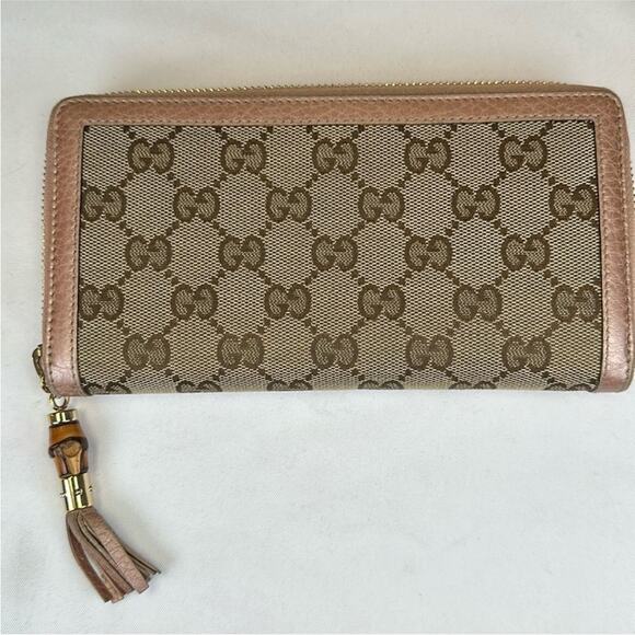 Gucci Handbags - Gucci GG long zip wallet w/ pink metallic leather trim and interior